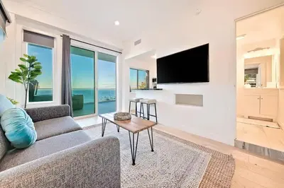 a living room with a couch and a table at Cliffside Haven Where Ocean Meets Sky in San Diego