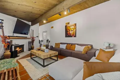 a living room with a couch and a fireplace at Mountain Majesty with AC BBQ Parking in Lemon Grove