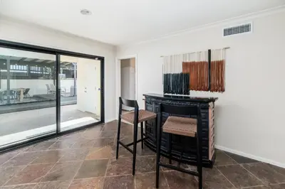 a room with a desk and a chair and a window at 5BR Oasis with Pool, Arcade, Sauna in La Mesa
