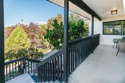 a balcony with a view of the trees at 5BR Oasis with Pool, Arcade, Sauna in La Mesa