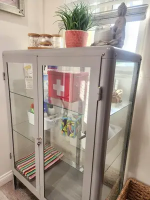 a glass cabinet with glass shelves in a room at Urban Beach Getaway 2 in San Diego