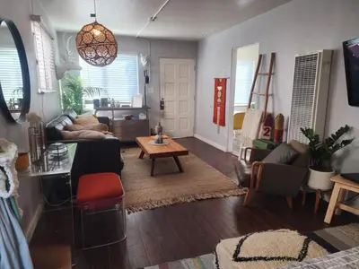 a living room with a couch and a table at Urban Beach Getaway 2 in San Diego