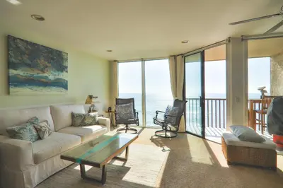 a living room with a couch and a table at Sea La Vie - DMST17 in Solana Beach