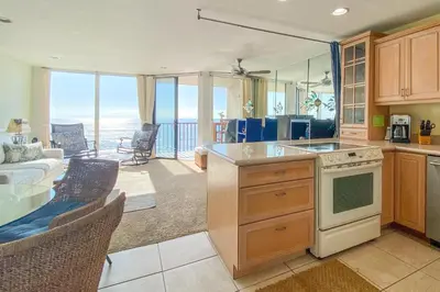 a kitchen and living room with a view of the ocean at Sea La Vie - DMST17 in Solana Beach