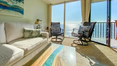 a living room with a couch and two chairs at Sea La Vie - DMST17 in Solana Beach