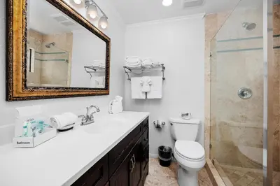 a bathroom with a sink and a toilet and a mirror at Seaside Shenanigans - DMBC751P in Solana Beach
