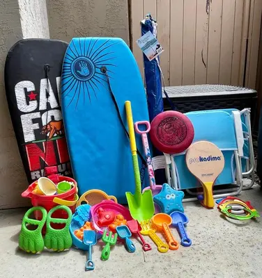a group of toys and a surfboard and other items at Seaside Shenanigans - DMBC751P in Solana Beach