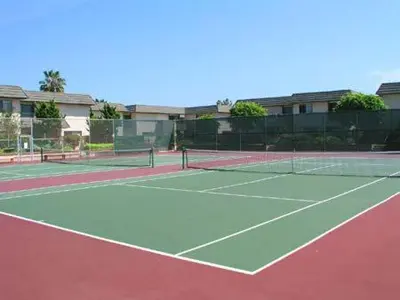 a tennis court with two tennis courts at Seaside Shenanigans - DMBC751P in Solana Beach