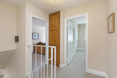 a hallway of a home with a stairway at Blissful SEA'renity - DMBC850S in Solana Beach