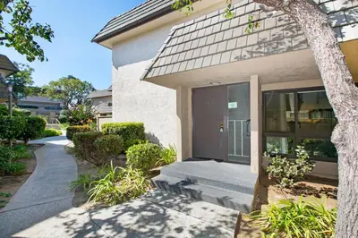 a house with a walkway leading to the front door at Blissful SEA'renity - DMBC850S in Solana Beach