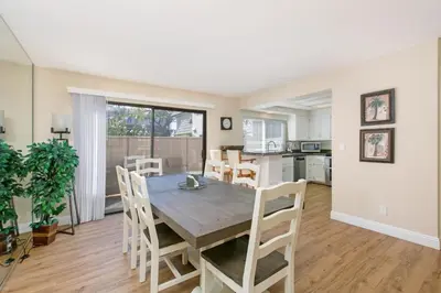 a dining room and kitchen with a table and chairs at Blissful SEA'renity - DMBC850S in Solana Beach