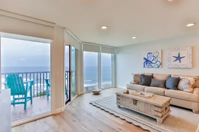 a living room with a couch and a table at Breathtaking Bungalow - DMST22 in Solana Beach