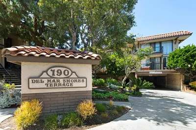 a sign in front of a building with a house at Enjoy Some Sea-clusion-DMST25 in Solana Beach