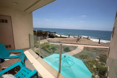 a balcony with a view of the beach at Serenity By The Sea - SBTC202 in Solana Beach