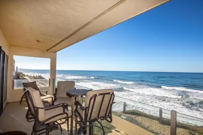 a balcony with chairs and a view of the ocean at Sunnyside Up! - SBTC213 in Solana Beach