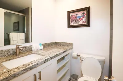 a bathroom with a sink and a toilet at Sunnyside Up! - SBTC213 in Solana Beach