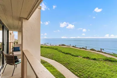 a balcony of a house with a view of the ocean at Bella Vista - SUR111 in Solana Beach