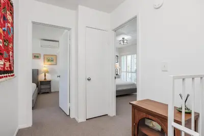 a living room with a door leading to a bedroom at Keepin' It Real - SB851VA in Solana Beach