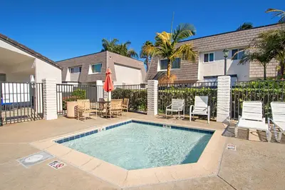 a swimming pool in front of a house at Keepin' It Real - SB851VA in Solana Beach