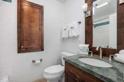 a bathroom with a white toilet and a sink at Paradise Found! - SBTC336 in Solana Beach