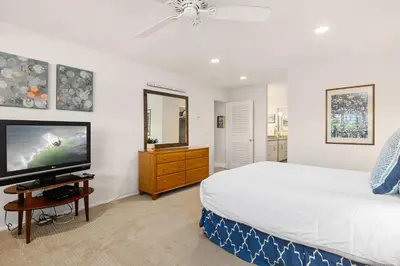 a bedroom with a bed and a flat screen tv at Let the Sea Set you Free SUR35 in Solana Beach
