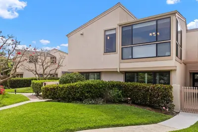 a large house with bushes in a yard at Let the Sea Set you Free SUR35 in Solana Beach