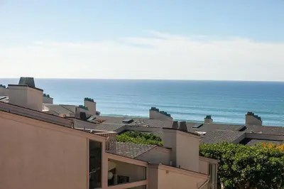 a view of roofs of buildings and the ocean at Paradise Awaits - SUR182 in Solana Beach