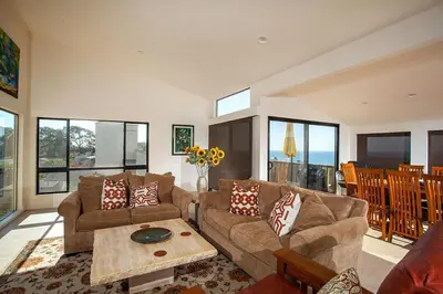 a living room with a couch and a table at Paradise Awaits - SUR182 in Solana Beach