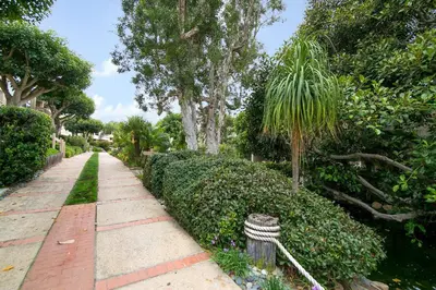 a garden path with a gardener practition at Tranquil Living - SUR4 in Solana Beach