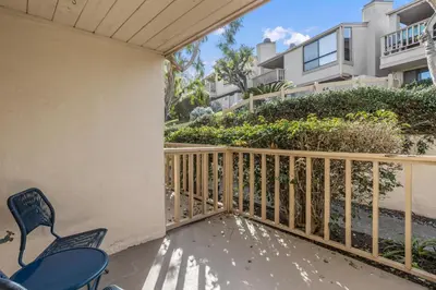 a balcony with chairs and a fence at Sun, Sand, & Vitamin Sea - SUR5 in Solana Beach