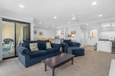 a living room with two blue couches and a table at Sun, Sand, & Vitamin Sea - SUR5 in Solana Beach