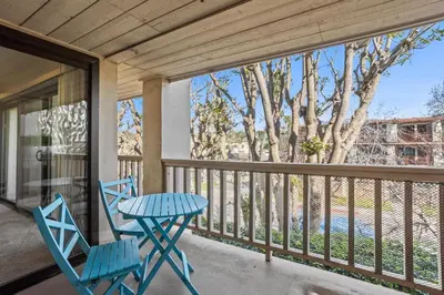 a patio with two chairs and a table on a balcony at Sun, Sand, & Vitamin Sea - SUR5 in Solana Beach
