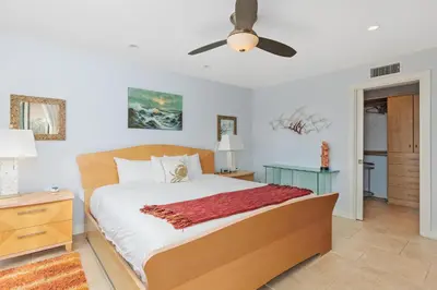 a bedroom with a bed and a ceiling fan at Sea Forever - DMST3536 in Solana Beach