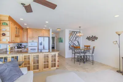 a kitchen and living room with a table and chairs at A Shore Thing! - DMST21 in Solana Beach