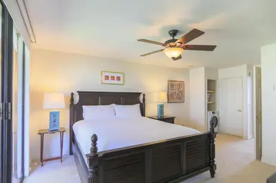 a bedroom with a bed with a ceiling fan at A Shore Thing! - DMST21 in Solana Beach