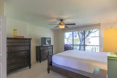 a bedroom with a bed and a ceiling fan at A Shore Thing! - DMST21 in Solana Beach