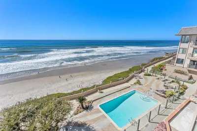 a view of the beach from the balcony of a condo at Beach View Beauty - DMBC775D in Solana Beach