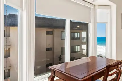 a dining room with a table and a large window at Beach View Beauty - DMBC775D in Solana Beach
