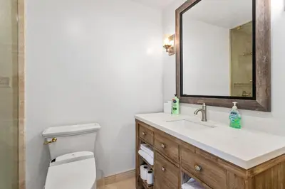 a bathroom with a sink and a mirror at Beach View Beauty - DMBC775D in Solana Beach