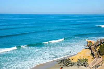an aerial view of the ocean with stairs on the beach at Beach View Beauty - DMBC775D in Solana Beach
