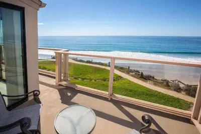 a balcony with a view of the ocean at Escape at Seascape - SUR112 in Solana Beach