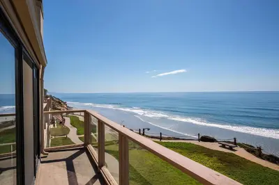 a view of the beach from a balcony at Escape at Seascape - SUR112 in Solana Beach
