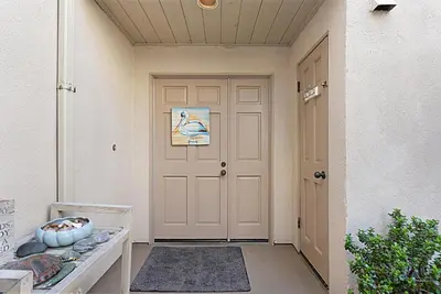 a front door of a house with a porch at Beach You To It! - SUR61 in Solana Beach