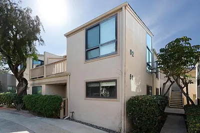 a building with trees and bushes in front of it at Beach You To It! - SUR61 in Solana Beach