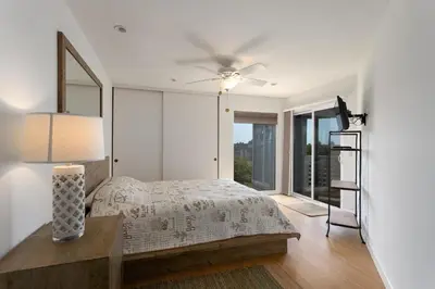 a bedroom with a bed and a ceiling fan at Vista Pacific - DM1050 in Del Mar