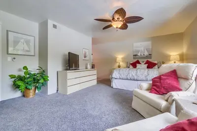 a bedroom with a bed and a ceiling fan at Bare Feet &Salty Hair-DMBC141S in Solana Beach