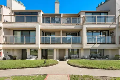 an exterior view of a building with balconies at Barefoot Oasis - SUR127 in Solana Beach