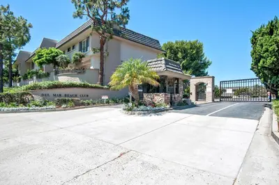 a house with a sign that reads our next end at Drift Away - DMBC884 in Solana Beach