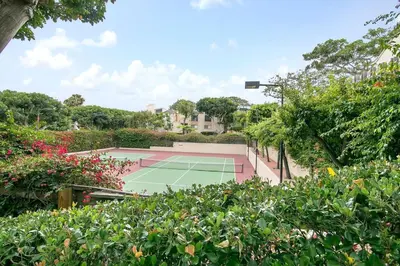 a tennis court in the middle of a garden at Casa Del Sol - SUR46 in Solana Beach