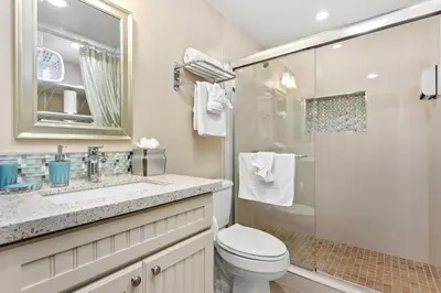 a bathroom with a toilet and a sink and a shower at Beachfront Bliss - DMBC815 in Solana Beach